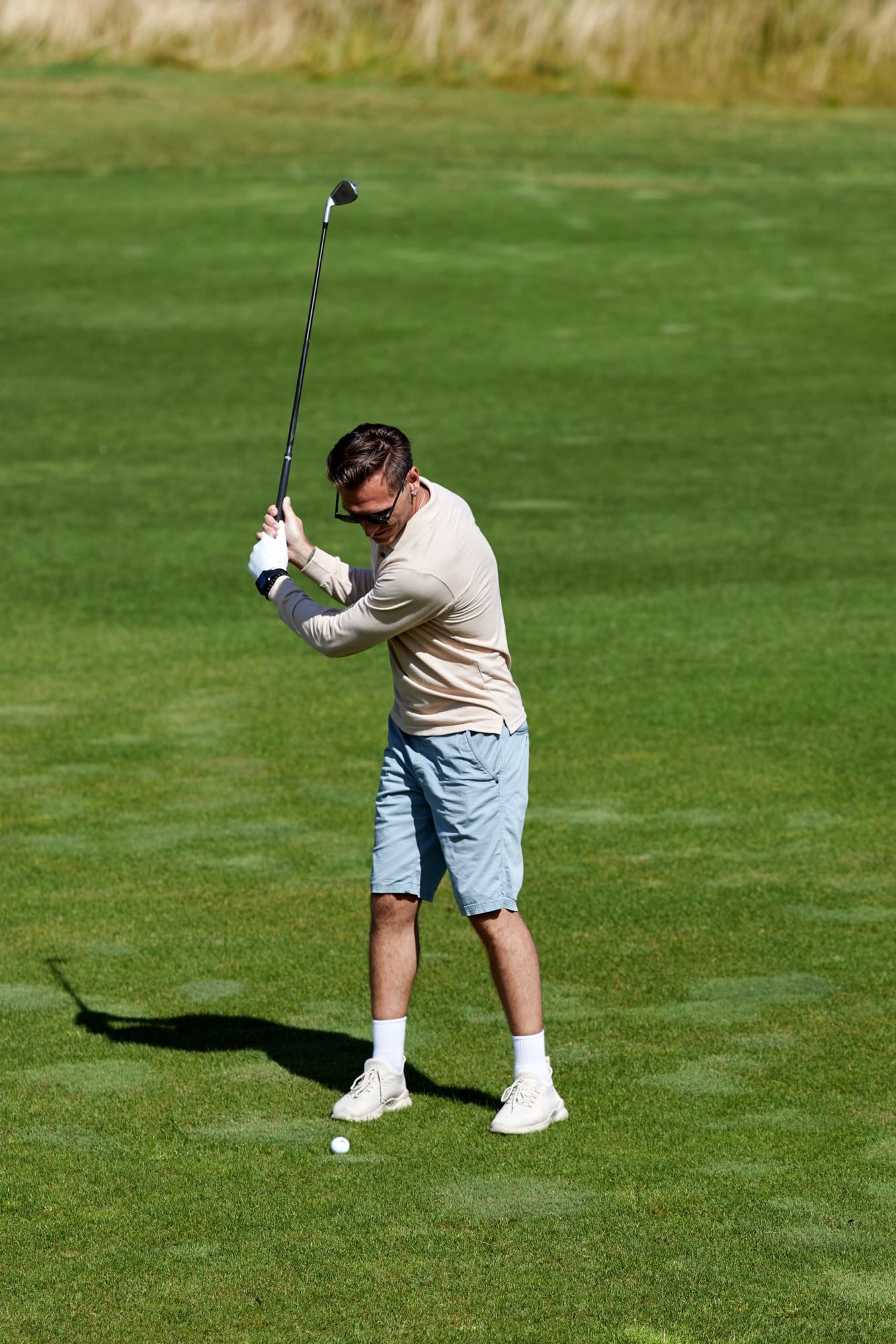 View At Man Playing Golf On Green Field And Swingi 2023 03 23 09 53 18 Utc 1
